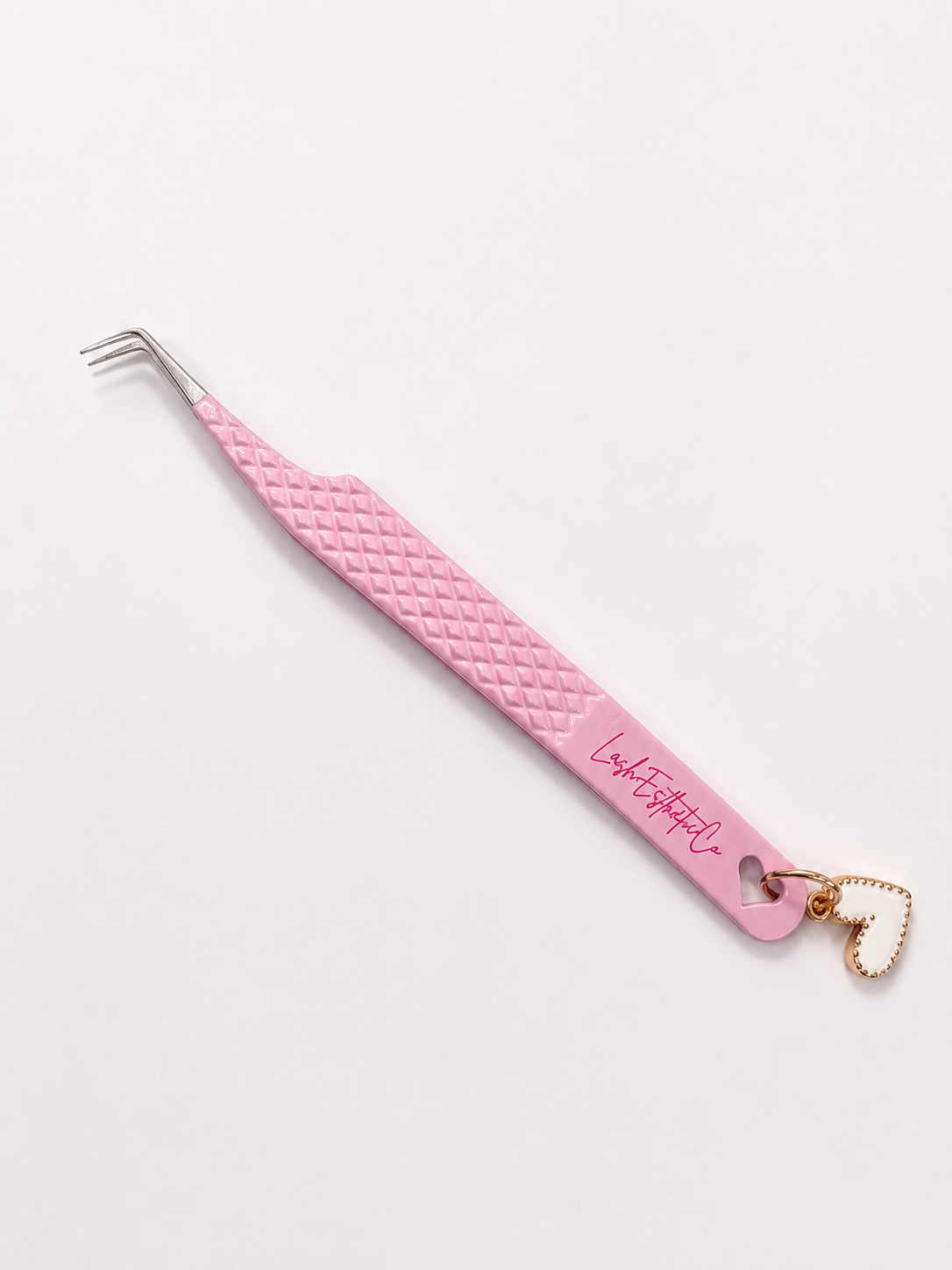 Light pink tweezer w/ charm