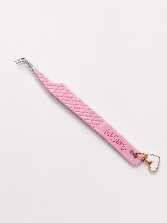 Light pink tweezer w/ charm